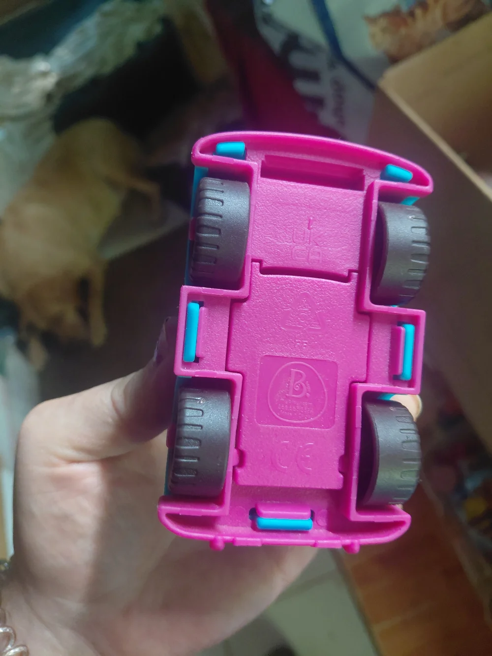 B. toys Happy Cruisers mini race car featuring a vibrant blue body with contrast